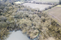 Aerial view of Worsbrough Country Park showing reservoir and trees