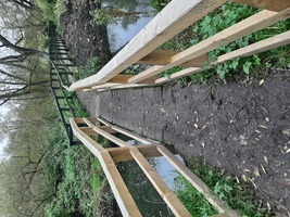 A narrow wooden bridge at the far side of the reservoir. 780mm, not suitable for large wheelchairs